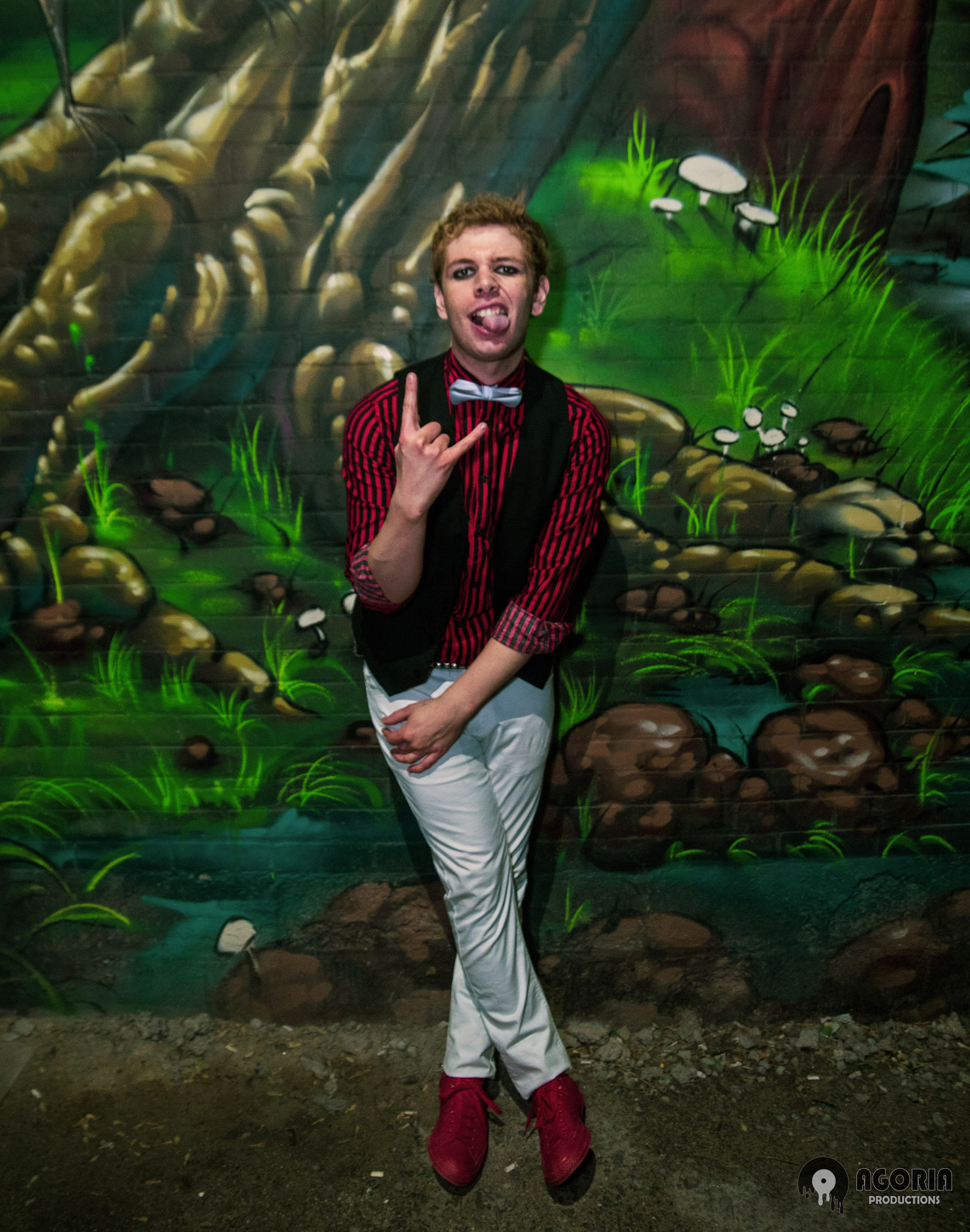 Fluffio Ryan Preiano posed infront of graffiti wall