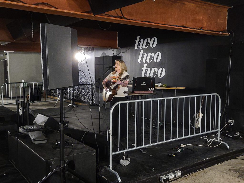 person playing guitar on stage