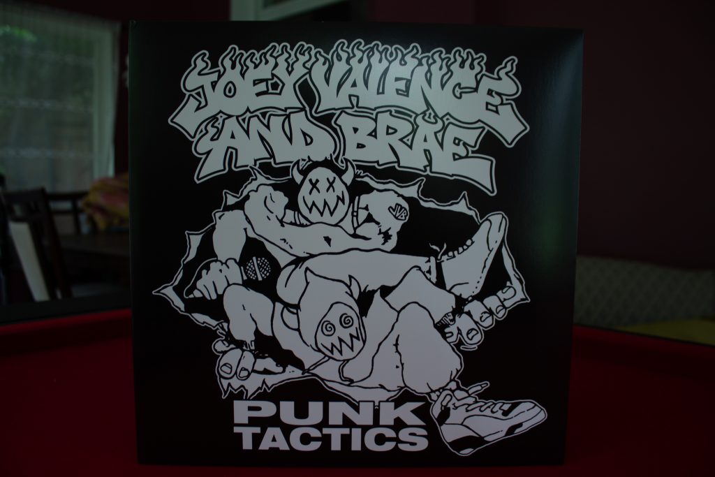 Vinyl record that says "Joey Valence And Brae: Punk Tactics"